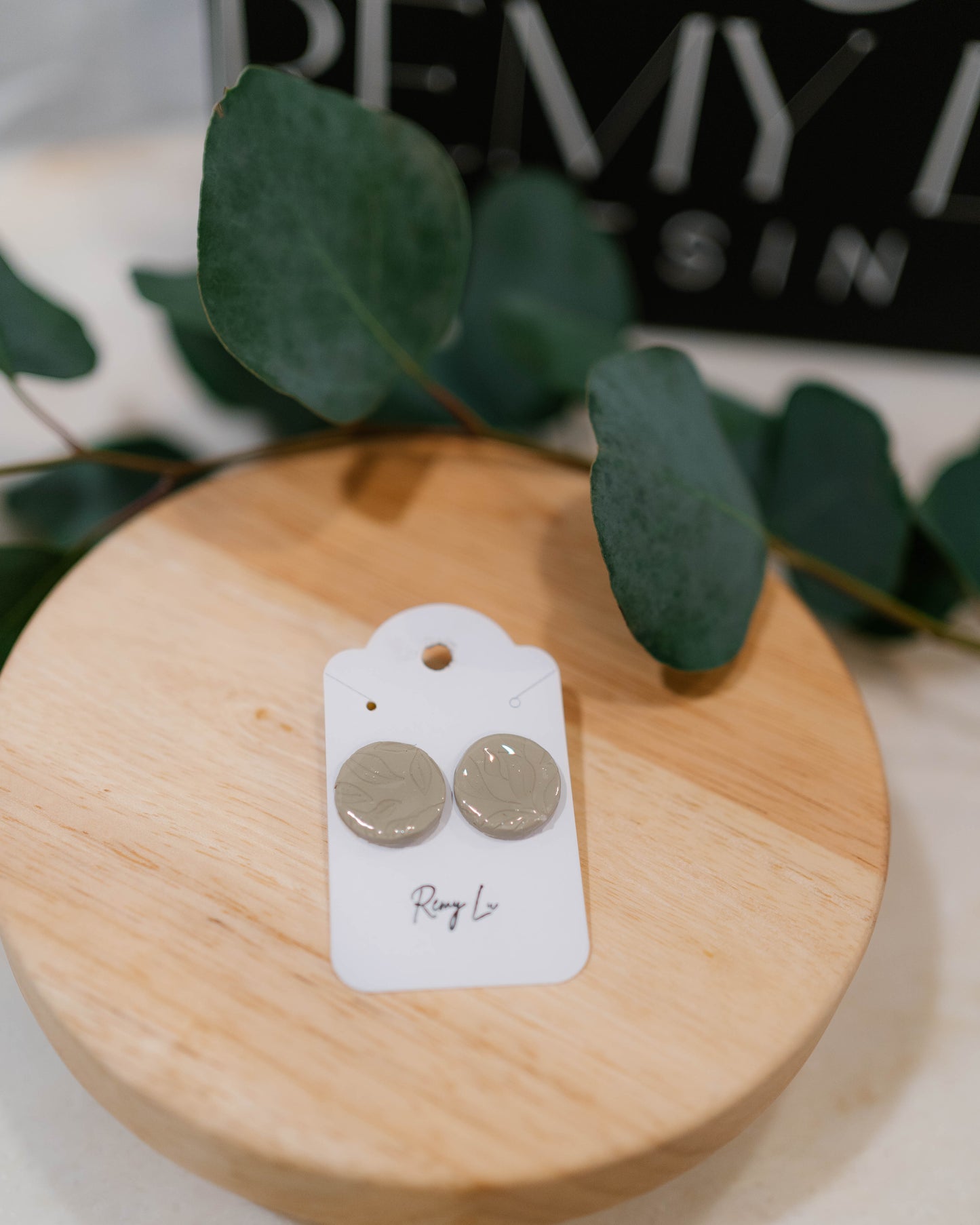 THE LUCA | round sage green studs with leafy imprints